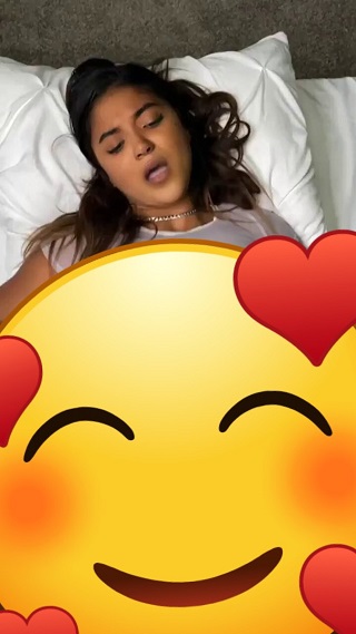 Performer holding a microphone under a bright spotlight